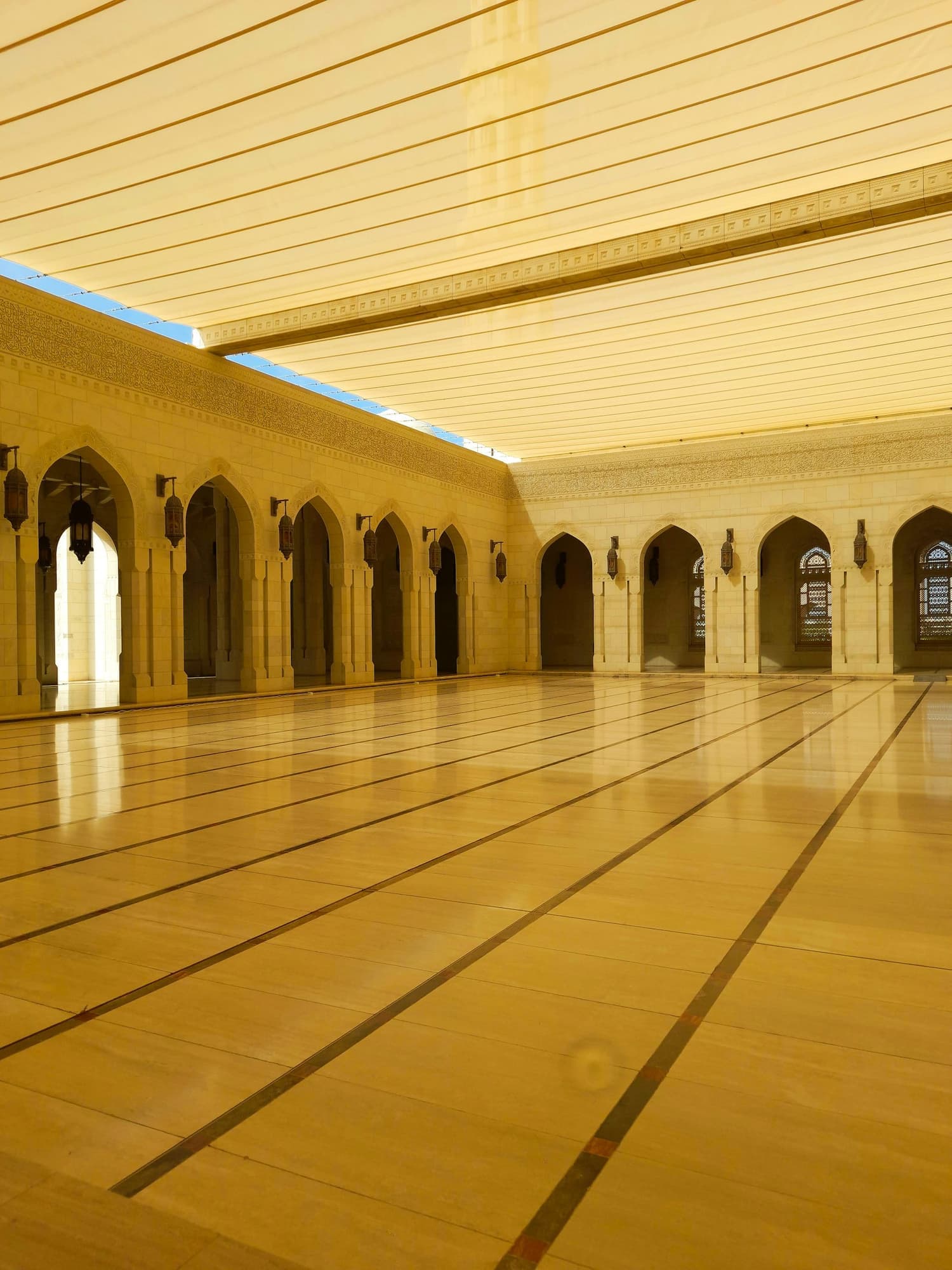 A mosque hall with a mirror-shine floor