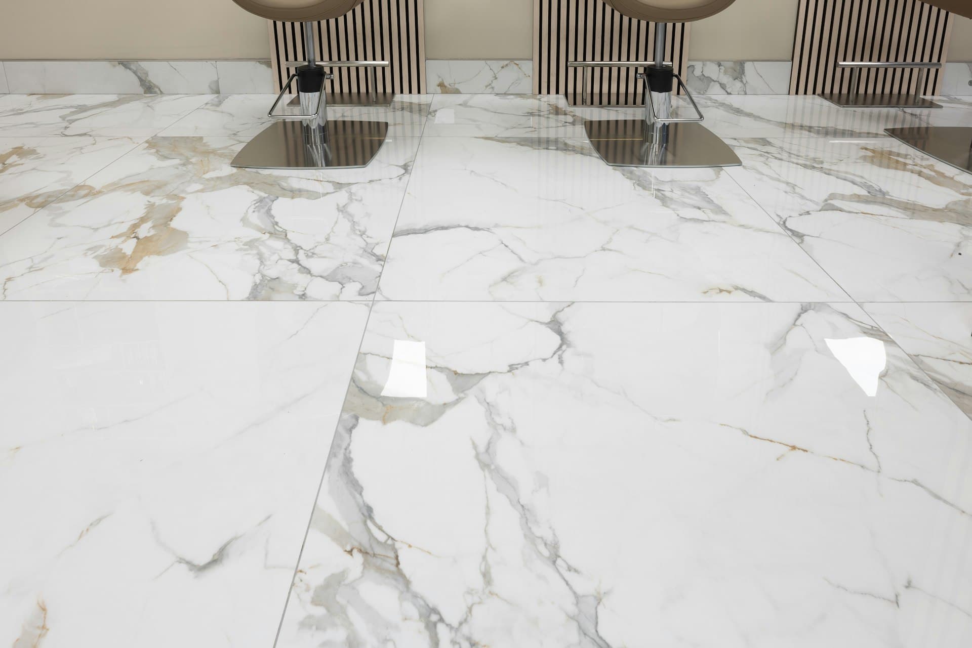 A bright white marble floor reflecting the room like a mirror