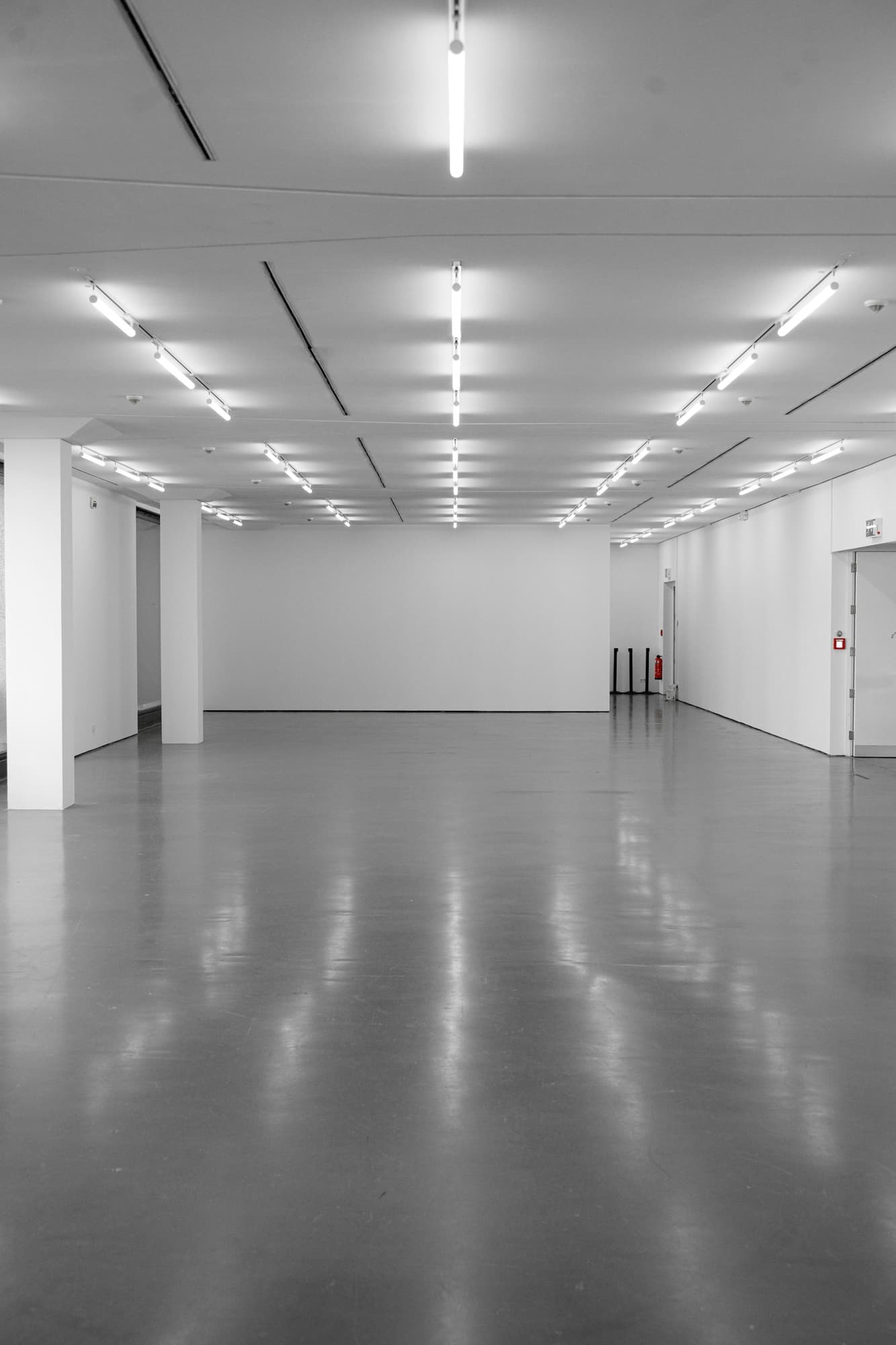 A white showroom with a reflective floor